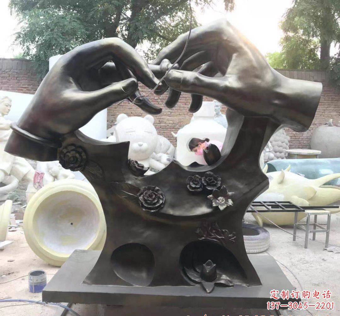 广西戴戒指景观铜雕
