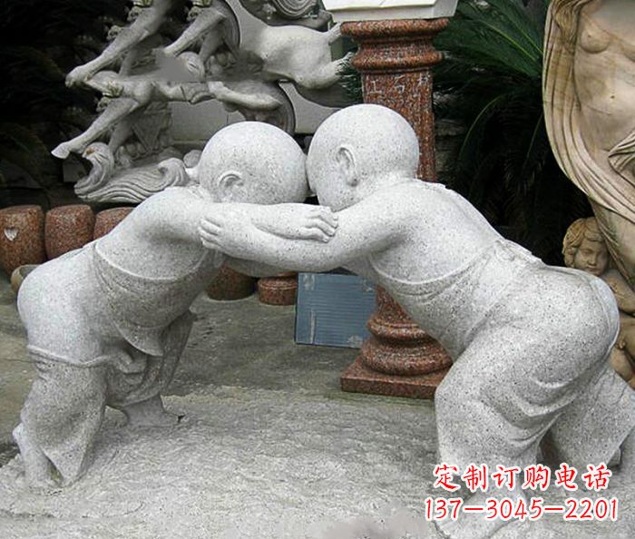 广西可爱小孩摔跤石雕