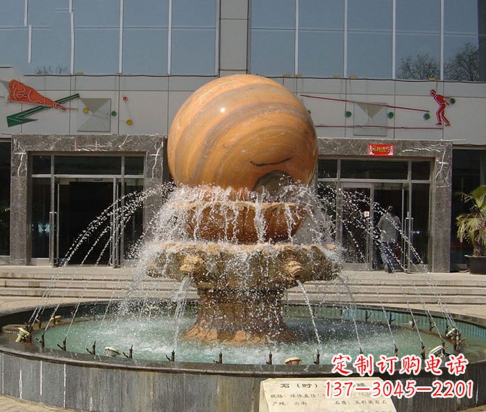 广西石来运转球晚霞红风水球石雕