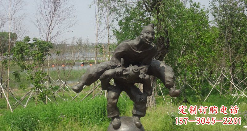 广西园林站在球上面跳山羊的人物景观铜雕
