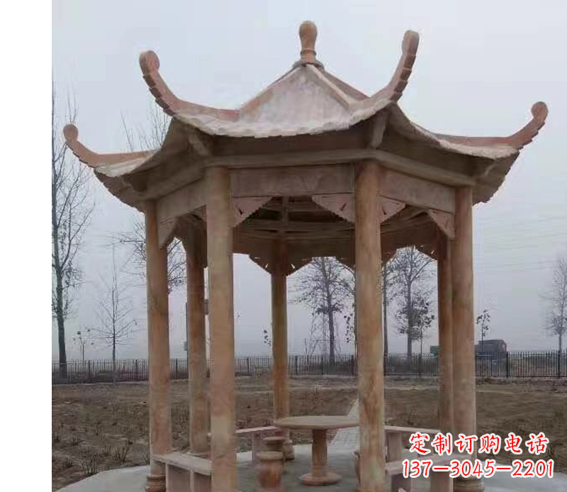 广西公园晚霞红八角石雕凉亭